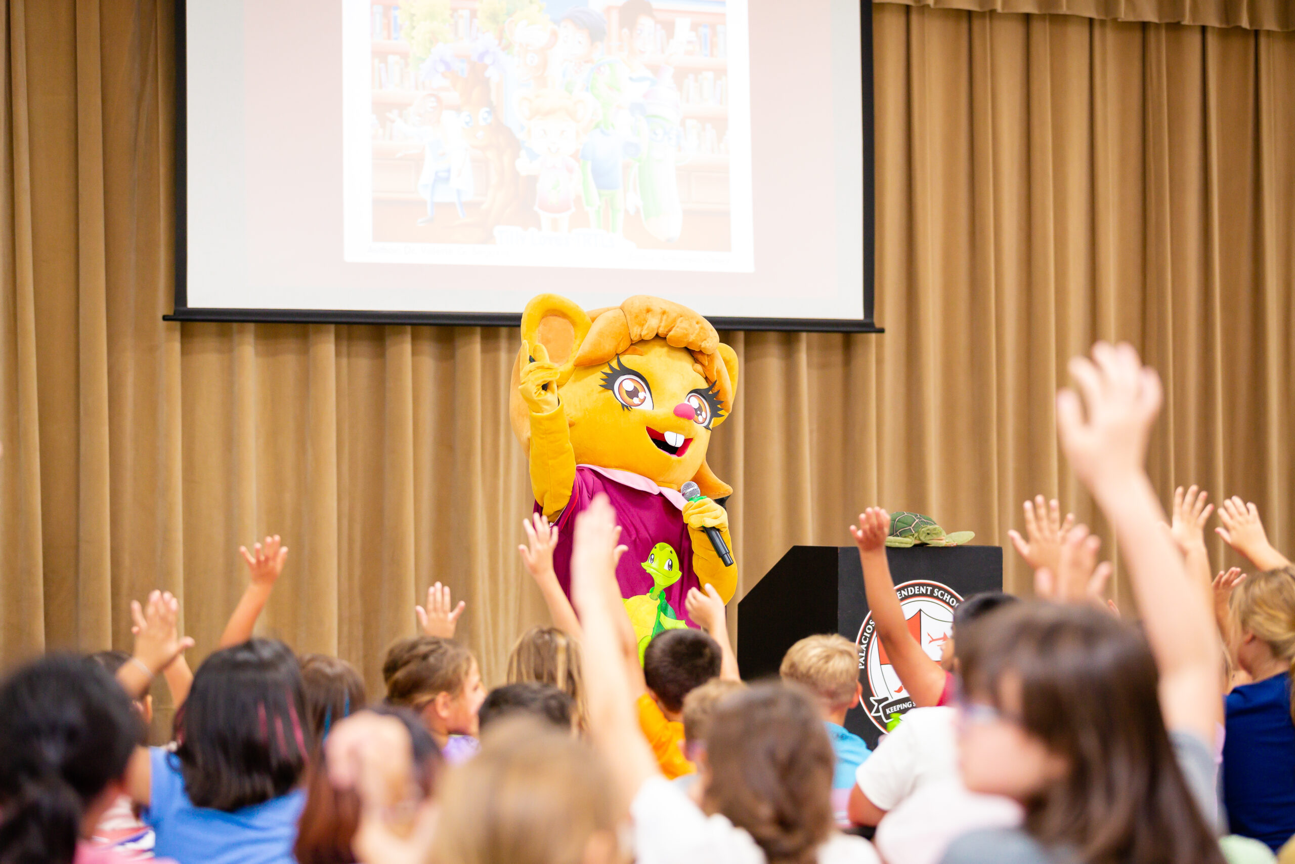Tilly engages with young students at Central Elementary in Palacios, Texas.